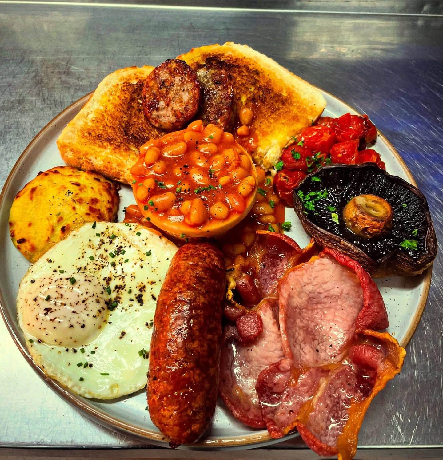 Breakfast Bodmin full plate with bacon sausage egg beans toast mushroom and tomatoes