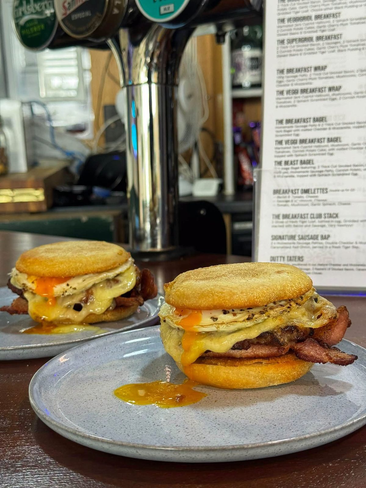 Breakfast Muffin special: sausage patty, free range egg, smoked bacon and melted cheese in a breakfast muffin
